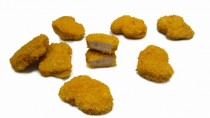 Cooked chicken formed nuggets